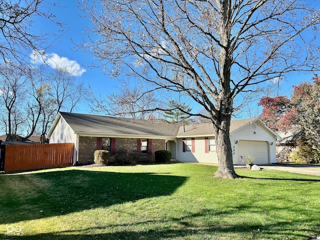 single story home featuring a front yard and a garage