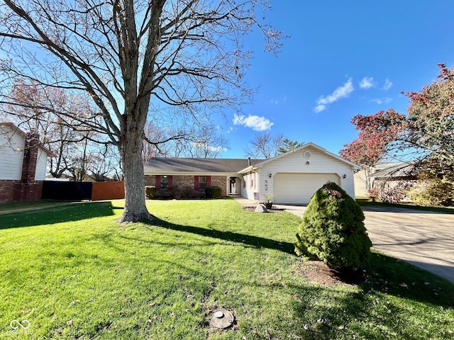 ranch-style house with a garage and a front lawn
