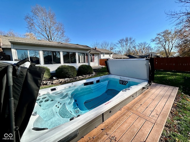 view of pool featuring a covered hot tub and a deck