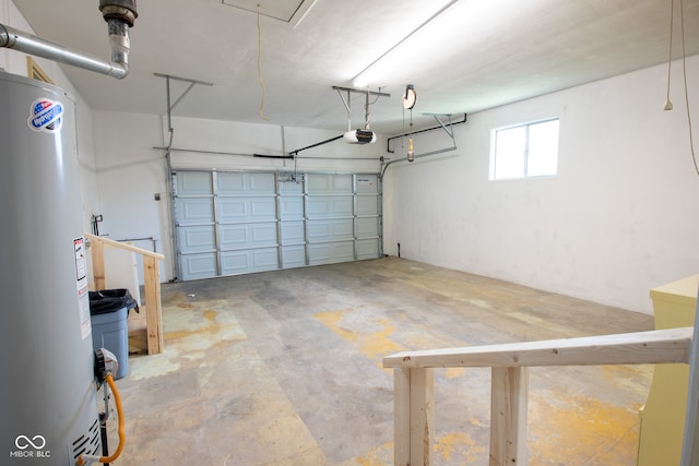 garage featuring gas water heater and a garage door opener