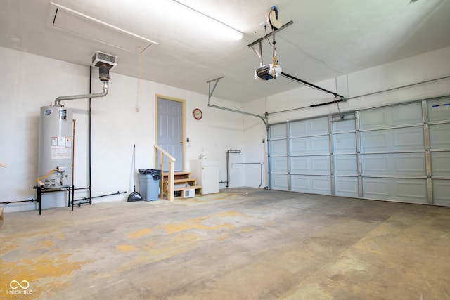 garage featuring water heater and a garage door opener