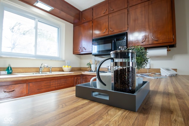 kitchen with light hardwood / wood-style floors and sink