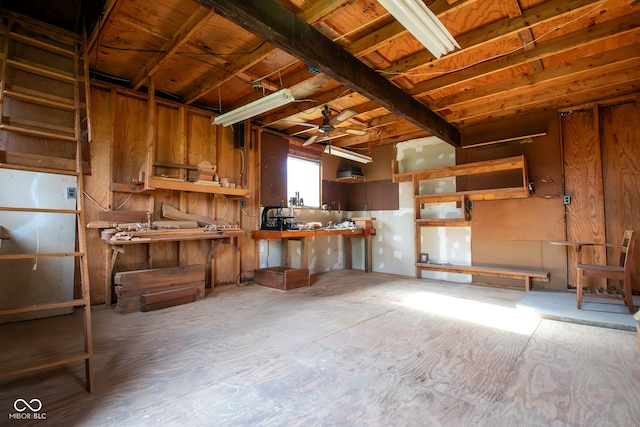 misc room featuring a workshop area and ceiling fan