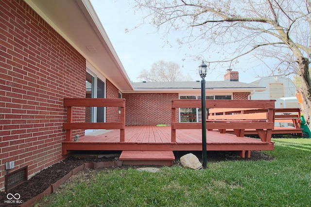 wooden deck with a lawn