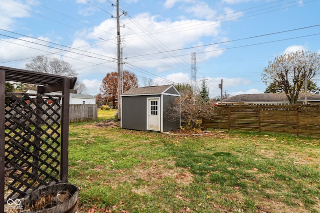 view of yard with a storage unit