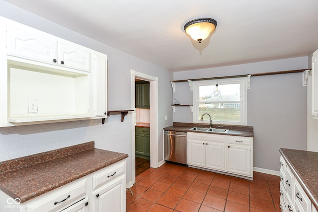 kitchen featuring dishwasher, light tile patterned floors, white cabinets, and sink