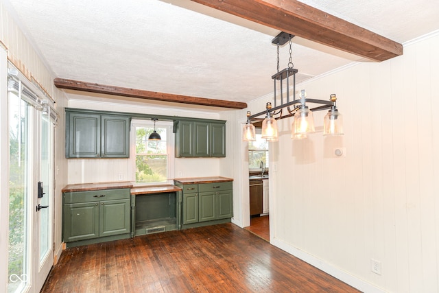 kitchen featuring green cabinets, wooden walls, dark hardwood / wood-style floors, decorative light fixtures, and beam ceiling