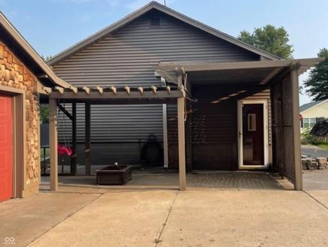 306 E Cherry St, Advance, IN 46102 - view of front of home with stone siding and a patio