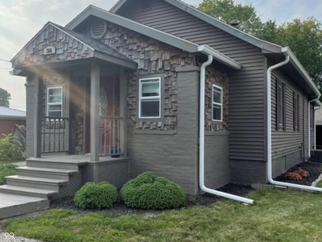 306 E Cherry St, Advance, IN 46102 - view of side of property featuring stone siding