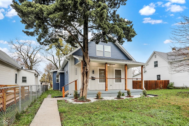 bungalow featuring a front yard and a porch