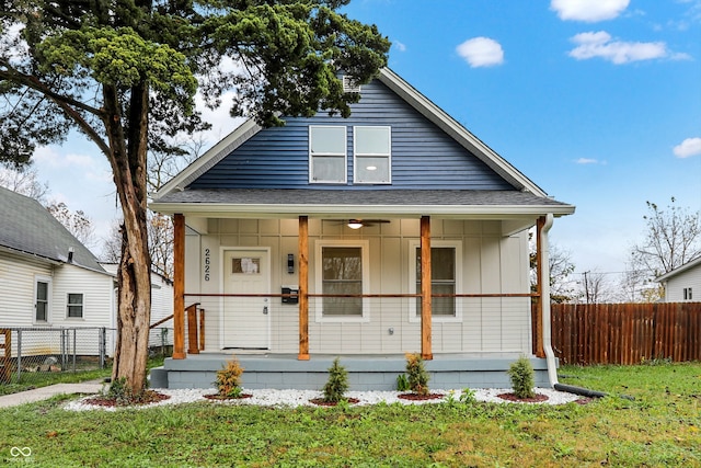 view of front of house with a porch and a front yard