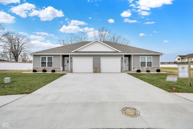 single story home with a garage and a front lawn