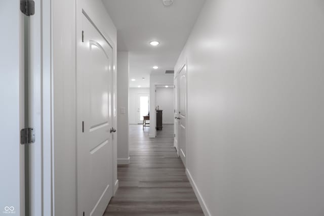 hallway featuring dark hardwood / wood-style flooring