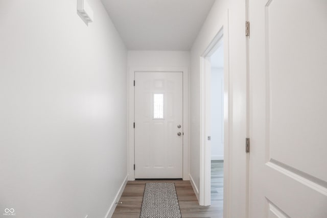 doorway with wood-type flooring