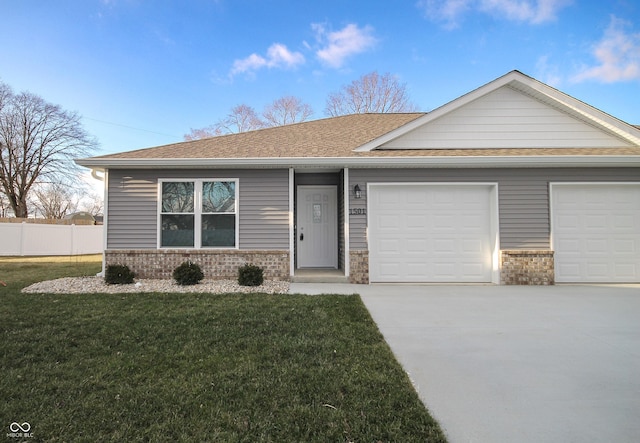 ranch-style home featuring a garage and a front yard