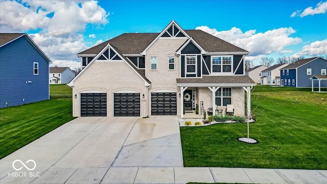 view of front of property with covered porch, a garage, and a front lawn