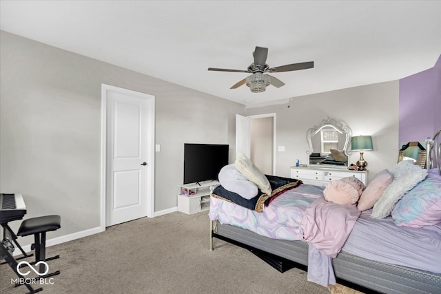 bedroom with ceiling fan and light carpet