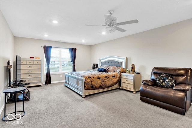 bedroom featuring ceiling fan and light carpet