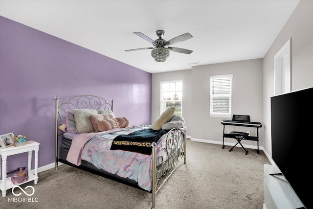 carpeted bedroom with ceiling fan