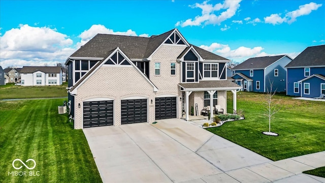 view of front of property featuring a front lawn and a garage