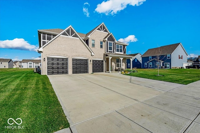 view of front of property with a garage and a front lawn