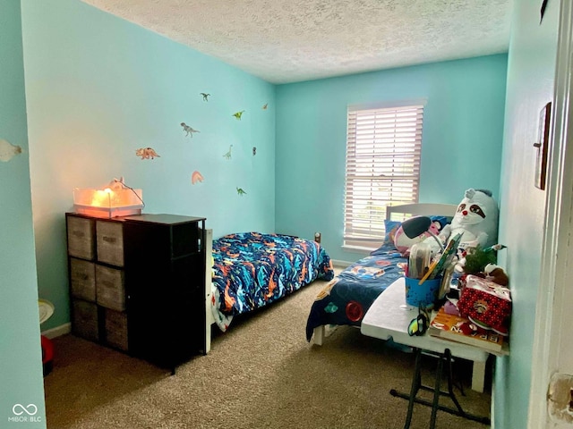 carpeted bedroom featuring a textured ceiling