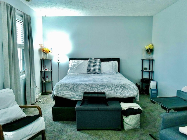 carpeted bedroom featuring a textured ceiling