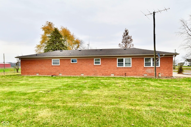 back of house featuring a yard