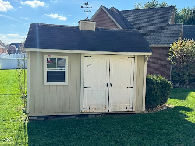 view of outdoor structure with a lawn