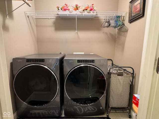 clothes washing area with washing machine and clothes dryer