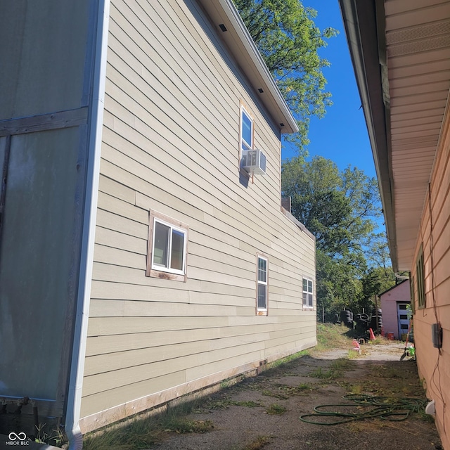 view of side of property featuring cooling unit