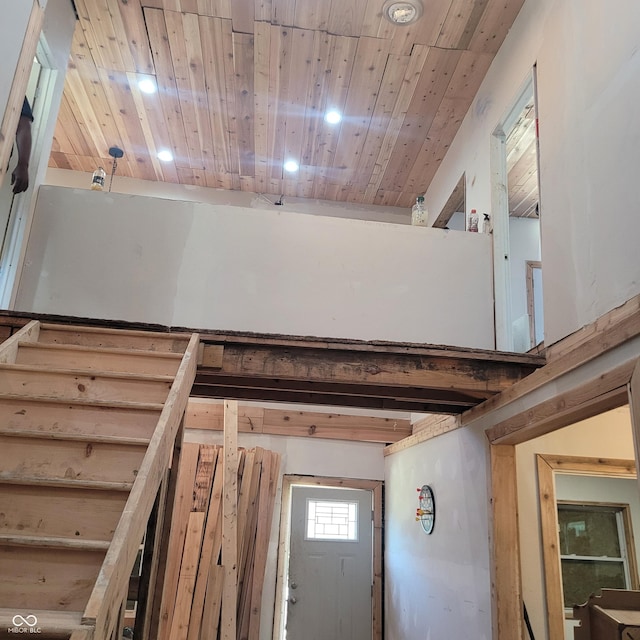 stairs with wooden ceiling