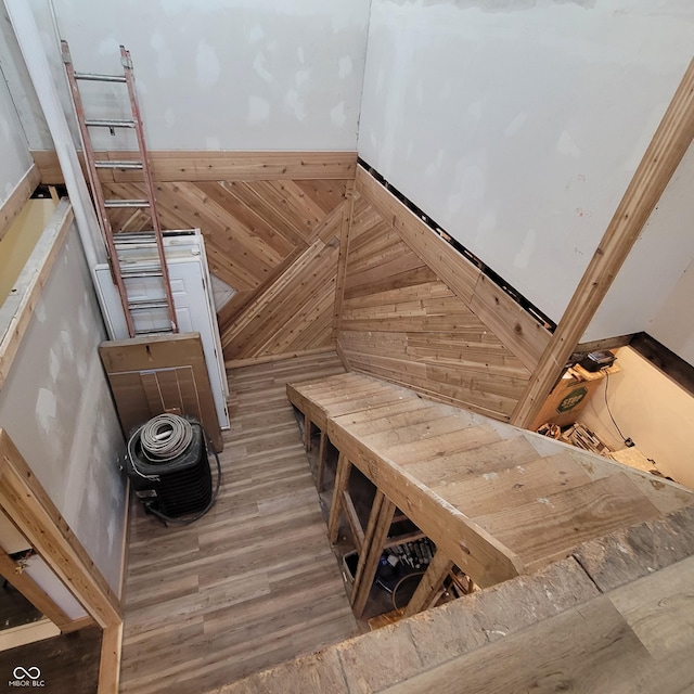 stairs featuring hardwood / wood-style floors