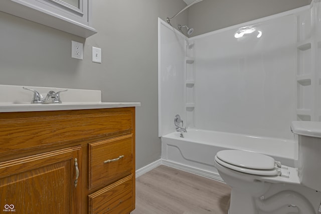 full bathroom featuring shower / tub combination, toilet, vanity, and hardwood / wood-style flooring