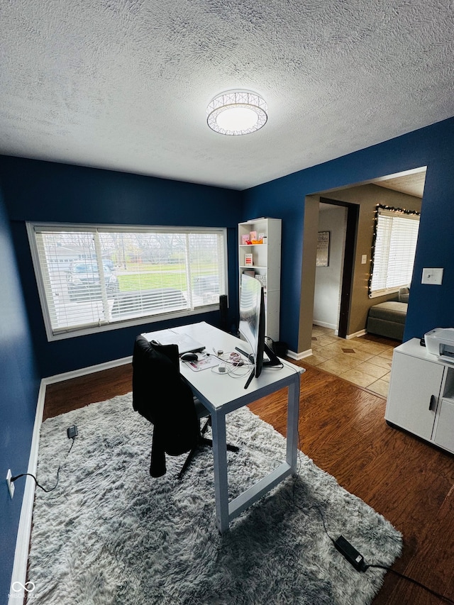 office space with hardwood / wood-style flooring and a textured ceiling