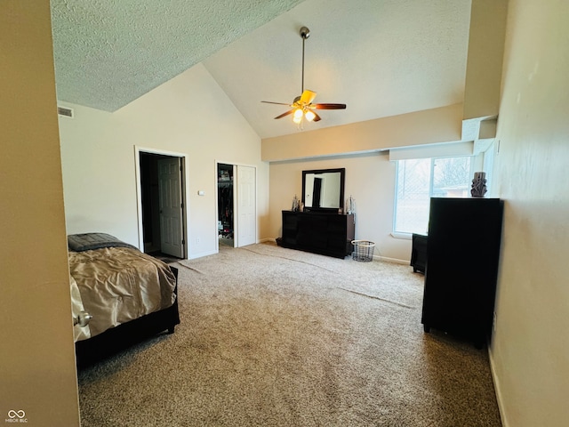 carpeted bedroom featuring ceiling fan, high vaulted ceiling, and a textured ceiling