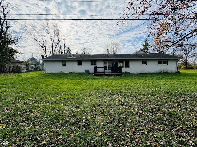 back of house featuring a lawn, cooling unit, and a wooden deck