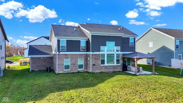 back of property featuring a lawn and a patio