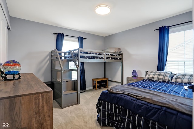 bedroom with light colored carpet