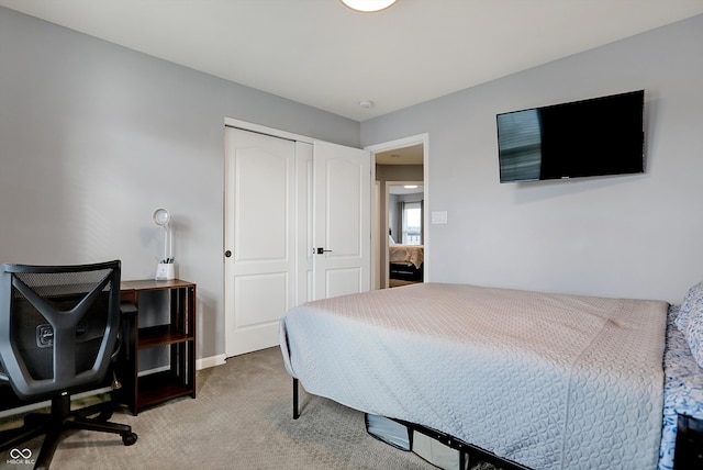 carpeted bedroom with a closet