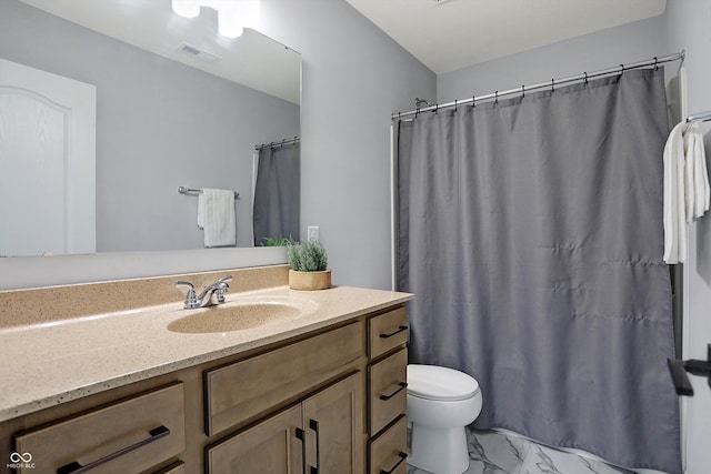 bathroom with vanity and toilet