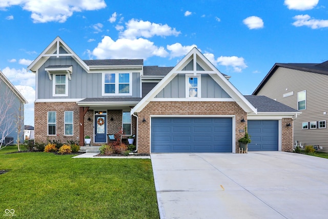 view of front of home featuring a garage and a front yard