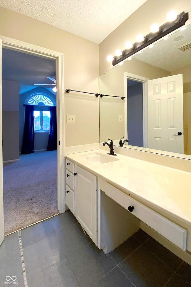 bathroom featuring vanity and a textured ceiling