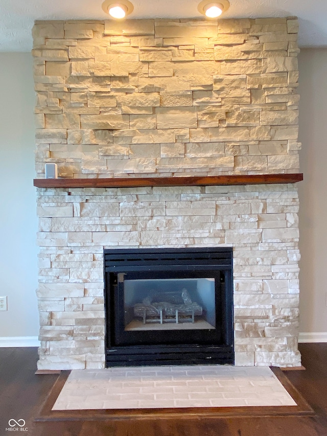 interior details with hardwood / wood-style floors and a fireplace