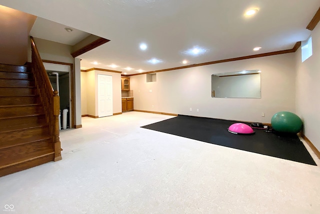 exercise room featuring ornamental molding