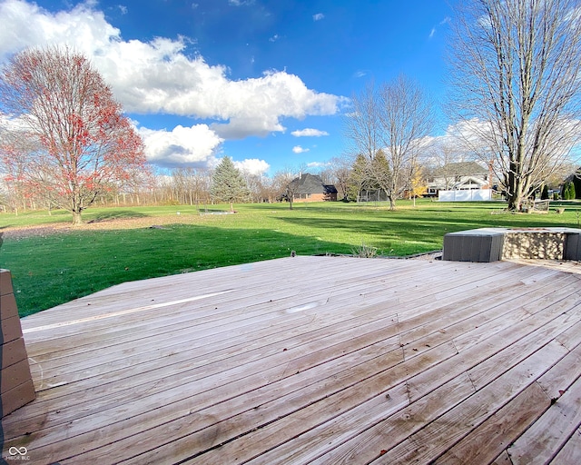 wooden deck featuring a yard