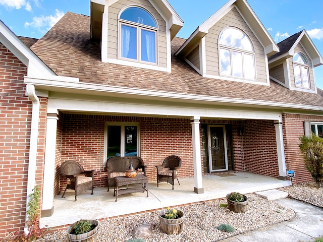 back of property with a porch