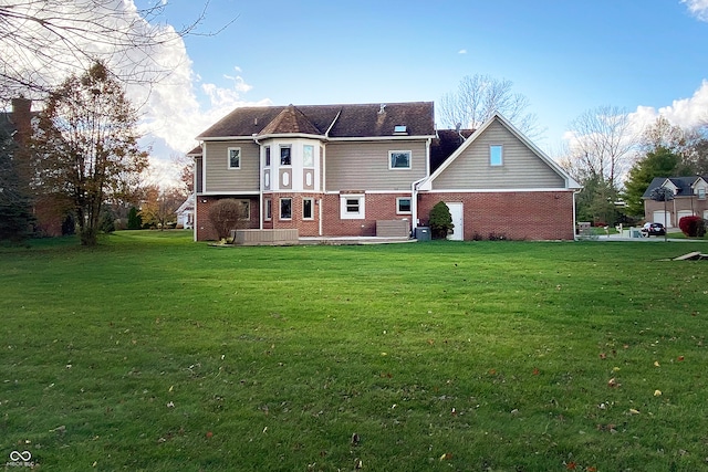 back of property with central AC unit and a lawn