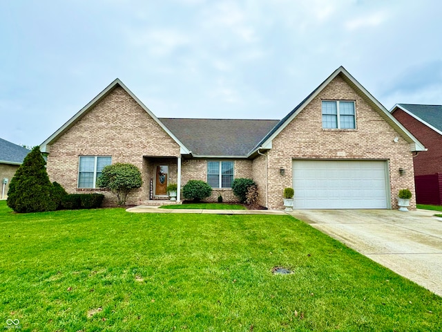 view of front of property with a garage and a front yard