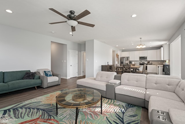 10797 Walden Ln, Brownsburg, IN 46112 - living area with a chandelier, recessed lighting, ceiling fan, dark wood finished floors, and baseboards